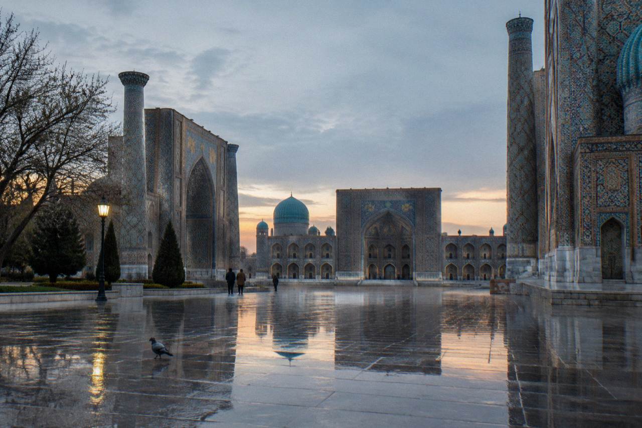 The tiled facades and domes of the Registan ensemble in Samarkand under a clear sky