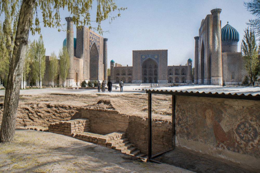 Excavated fresco wall and mud brick foundations at the Afrasiyab museum site