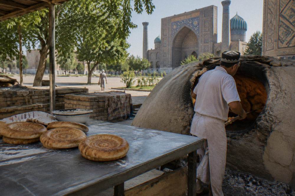 Round stamped Samarkand bread fresh from a wood fired oven at a city bakery