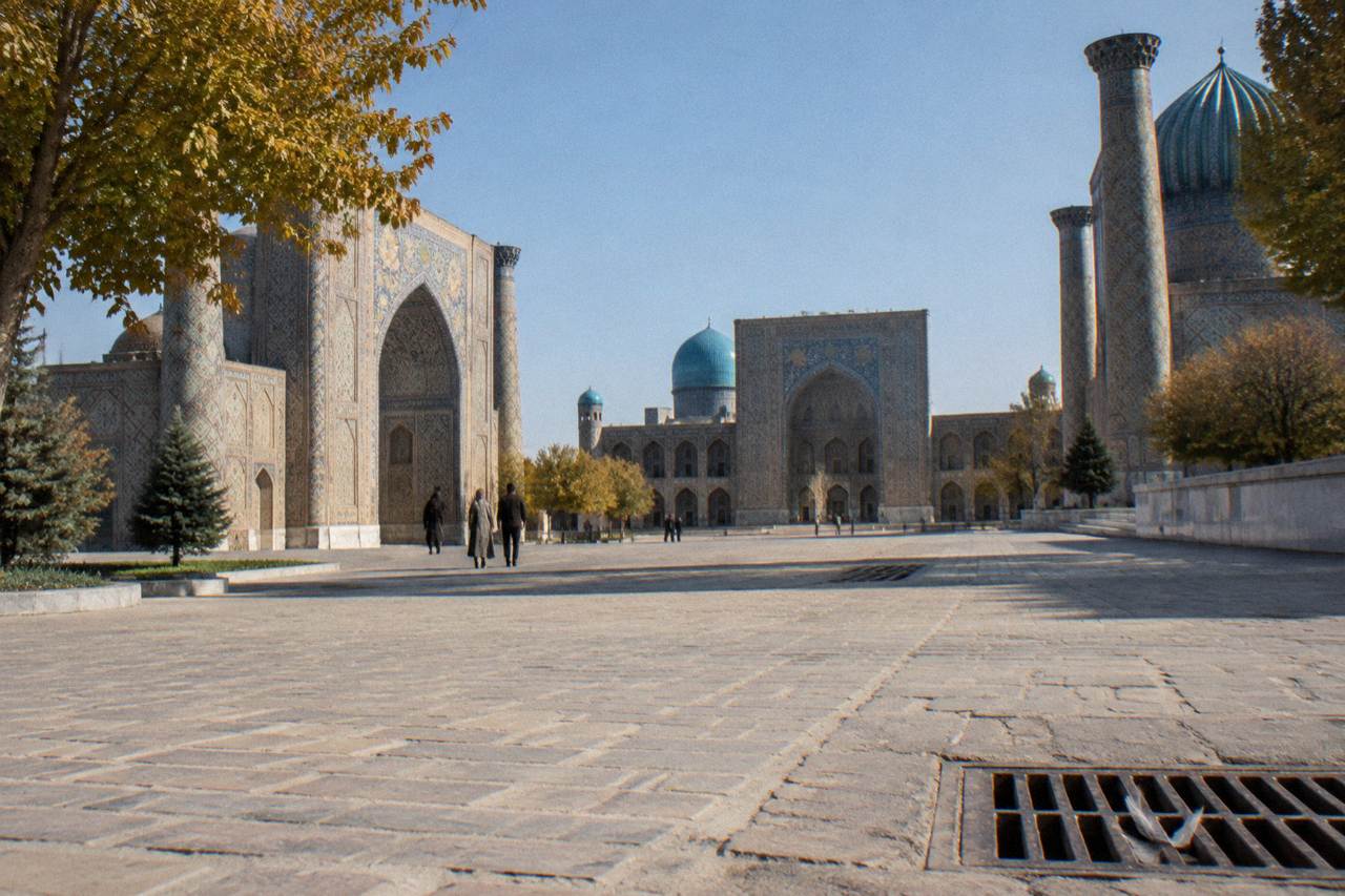 Blue tiled domes and minarets of the Registan ensemble under a clear sky