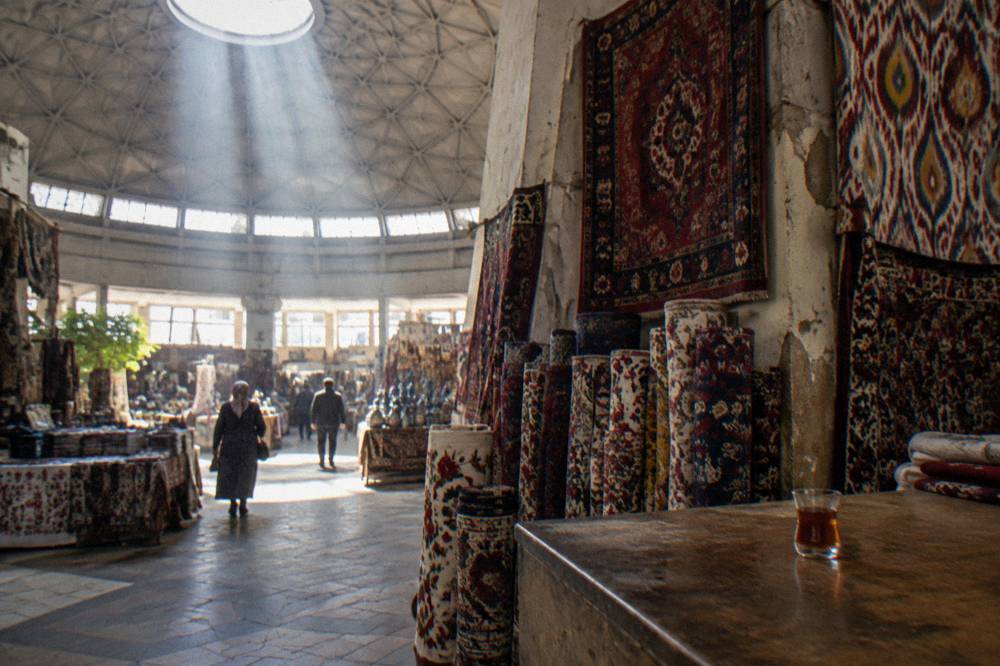 Covered market dome with hanging carpets and textiles inside
