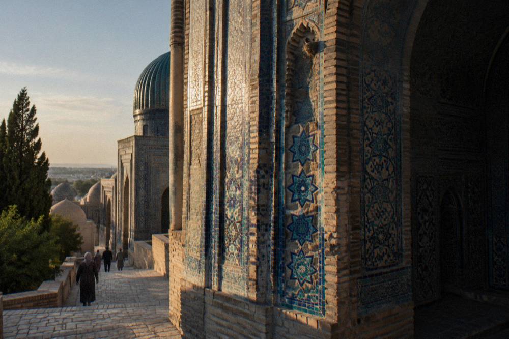 An intricate tiled portal with geometric patterns at a Samarkand mausoleum
