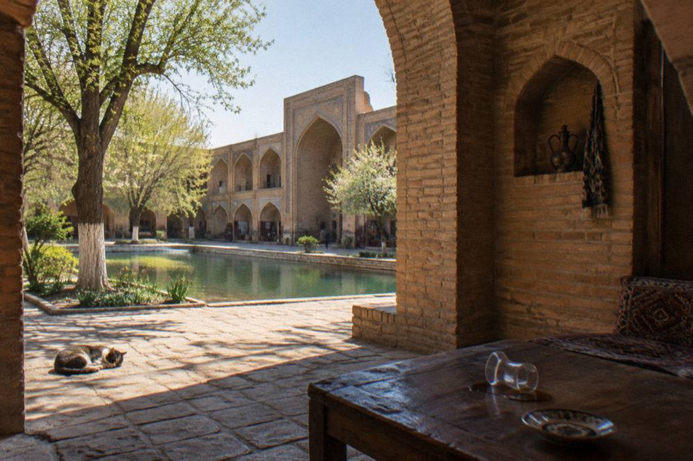 Interior courtyard of a restored caravanserai with arched brick alcoves