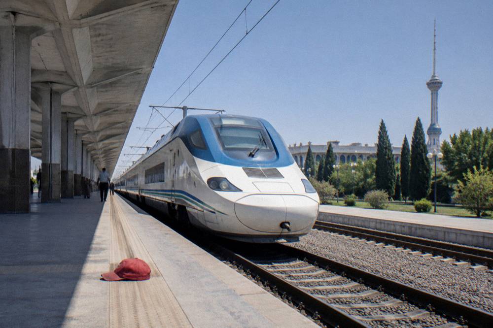 Modern high-speed train waiting at a bright railway platform in Tashkent